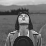 A woman taking a deep breath