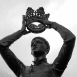 A statue holding a crown.